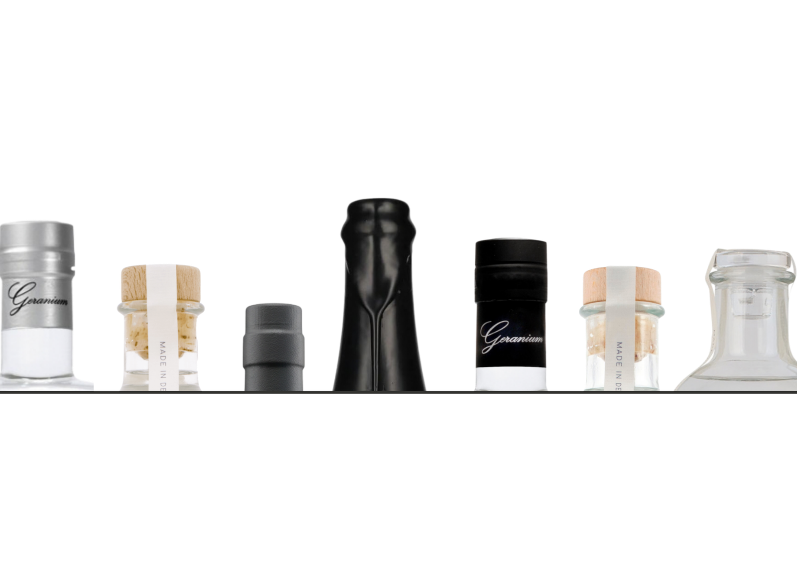A row of bottle closures: Geranium caps, corks marked Made in Denmark, and a wax seal.